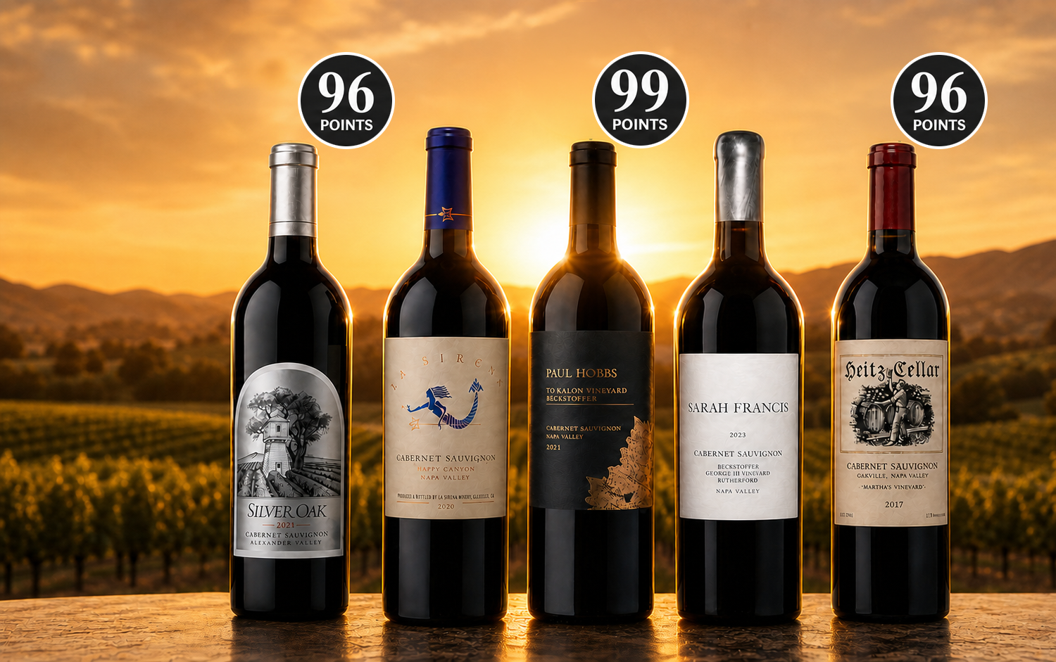Silver Oak, La Sirena, Paul Hobbs To Kalon, Sarah Francis and Heitz Martha’s Vineyard Cabernet bottles overlooking Napa Valley at sunset, with 96-, 99- and 96-point badges.